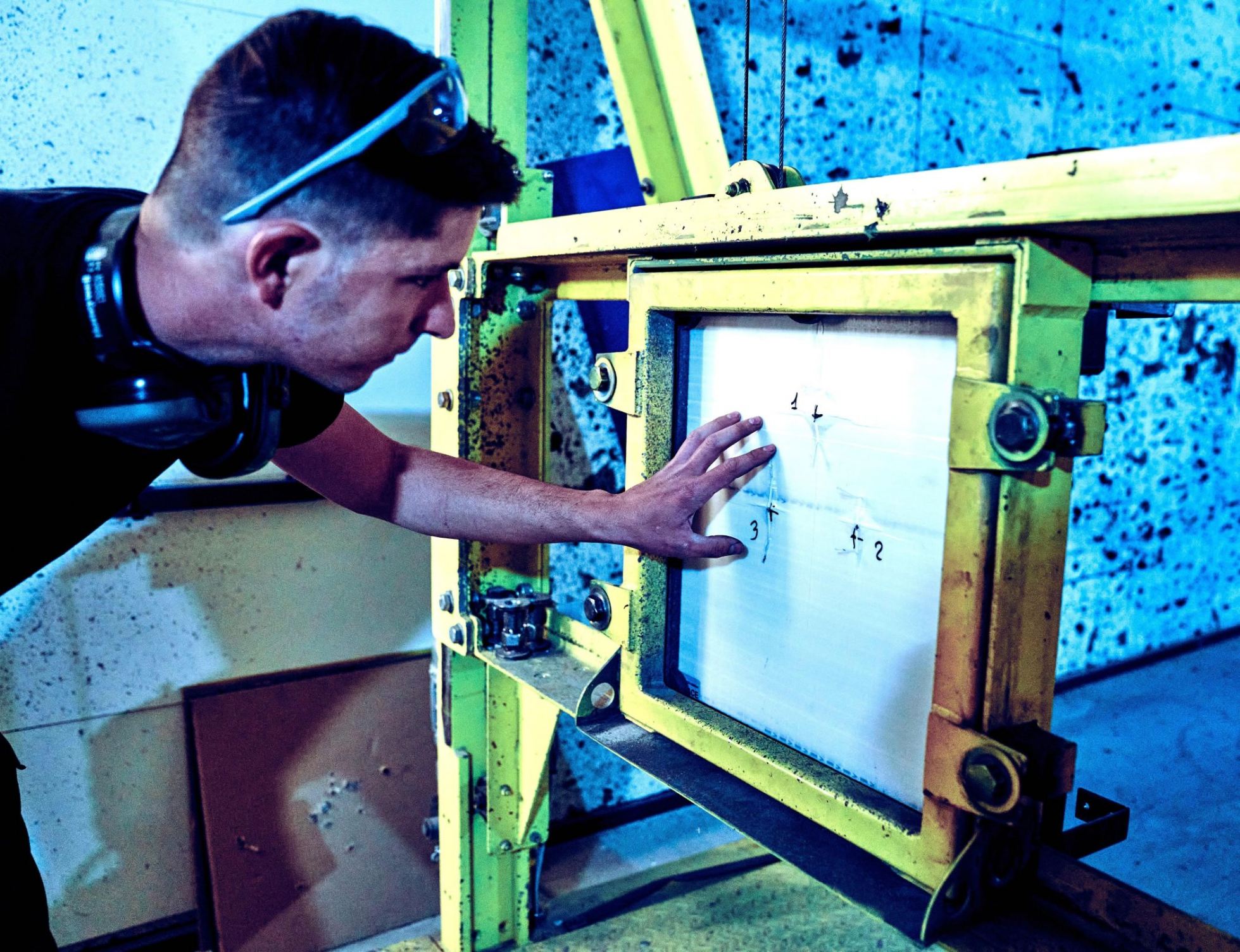 Testing armor material. PHOTO: Holy Cow Media